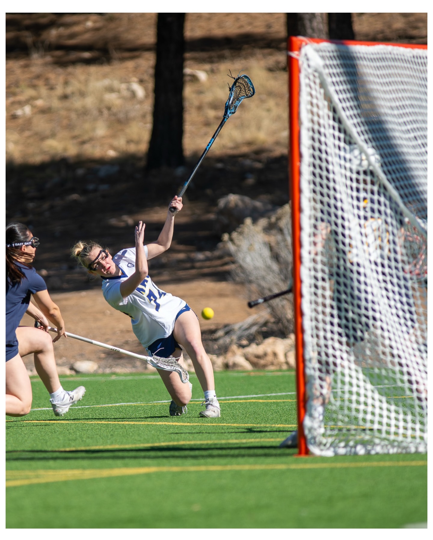 Northern Arizona University Women’s Lacrosse Club player shooting on goal during a game
