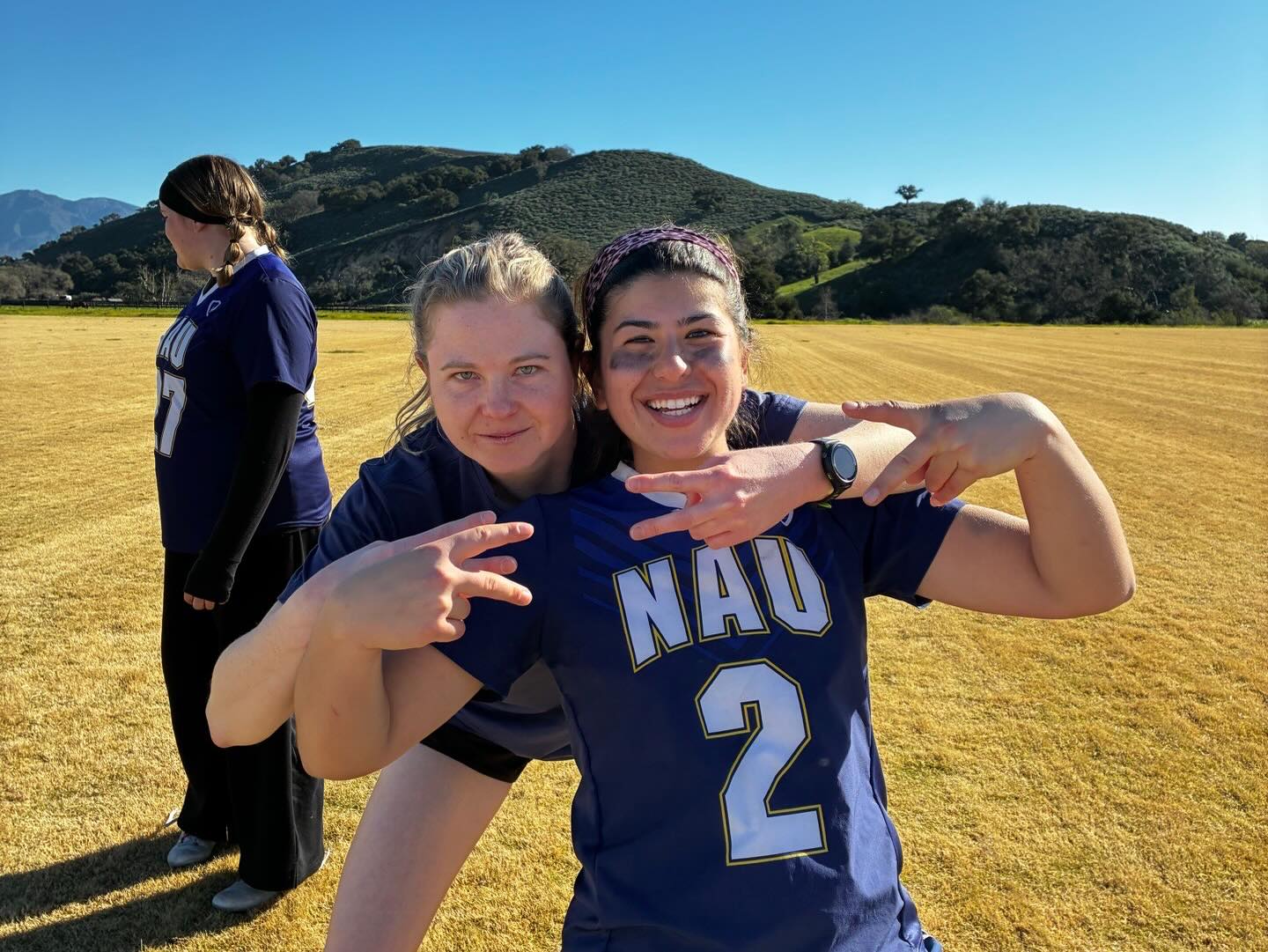 Northern Arizona University Women’s Lacrosse Club teammates celebrating together after a game